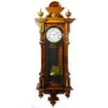 A late 19th century mahogany Vienna regulator wall clock, inlaid with burr-walnut sumounts, the eig