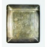 A silver cigarette case, London 1915, with top sliding mechanism, plain reverses with engine