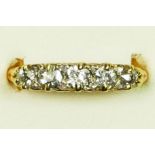 A Victorian 18ct gold and old cut brilliant five stone diamond ring, unhallmarked, carved claw set