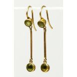 An Edwardian 15ct gold peridot drop pair of ear pendants, 15 tab, 30mm, 1.6gm.
