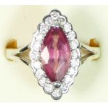 An 18ct white gold pink tourmaline and diamond cluster ring, claw set with a navette cut stone, 13 x