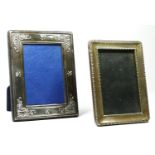A silver photograph frame, Sheffield 1919, with bead border, 17 x 12.5cm and another Sheffield 1989,