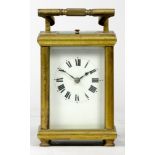 A French carriage clock, of rectangular form having enamelled dial with Roman numerals, the brass