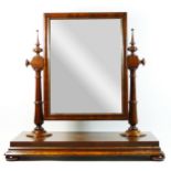 A Victorian mahogany swing mirror, with turned supports, 60 x 61cm.