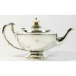 A silver teapot by Edward Barnard & Sons Ltd., London 1919, the handle with splayed trefoil