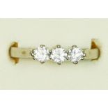 An 18ct white gold and three stone brilliant cut diamond ring, stated weight 0.50cts, colour
