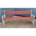 A mid-Victorian cast iron and later weathered hardwood timber slatted three seater garden bench,