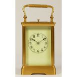 A brass striking and repeating carriage clock, striking the half and hours on a gong, 14cm.