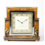 A 1920's Art Deco English Chinoiserie mantel clock, having a silvered dial with arabic numerals