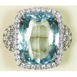A 18ct white gold, aquamarine and diamond dress ring, stamped 750, claw set with a 15.35ct stone,
