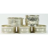 A set of three silver napkin rings, Birmingham 1947, engine turned decoration, initialled KC, and