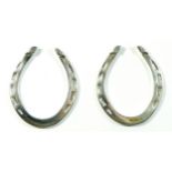 A pair of cast silver horse shoes, Sheffield 1974, 5.5 x 4.5cm, 50gm