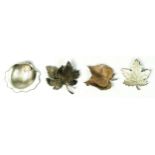 Four silver floral brooches, 25gm