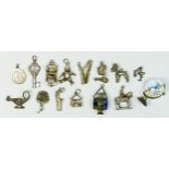 15 silver charms, 63gm