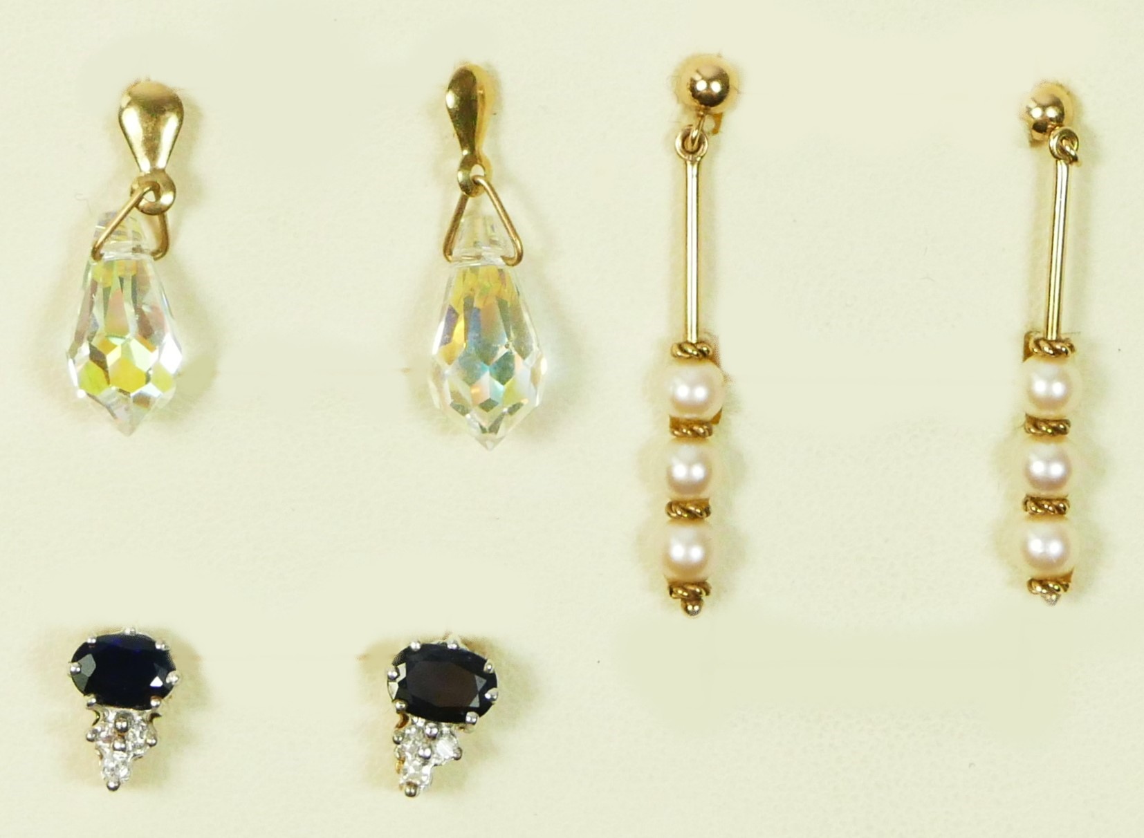 A 9ct gold pair of sapphire and white stone ear studs, 1.5gm and two other pair of ear rings