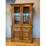 A Barker and Stonehouse mahogany glazed display cabinet, comprising of glazed doors opening to