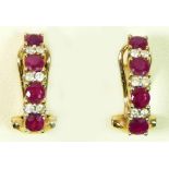 A pair of 9ct gold ruby and brilliant cut diamond ear studs, 16 x 4mm, 2.8gm