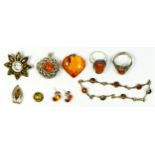 A silver and amber bracelet, two rings and five other pieces, 47gm.