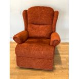 A Sherborne electric recliner/riser high-backed armchair, upholstered in a burgundy chenille fabric.