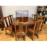 A Victorian mahogany wind-out extending dining table with moulded outline and rounded ends enclosing