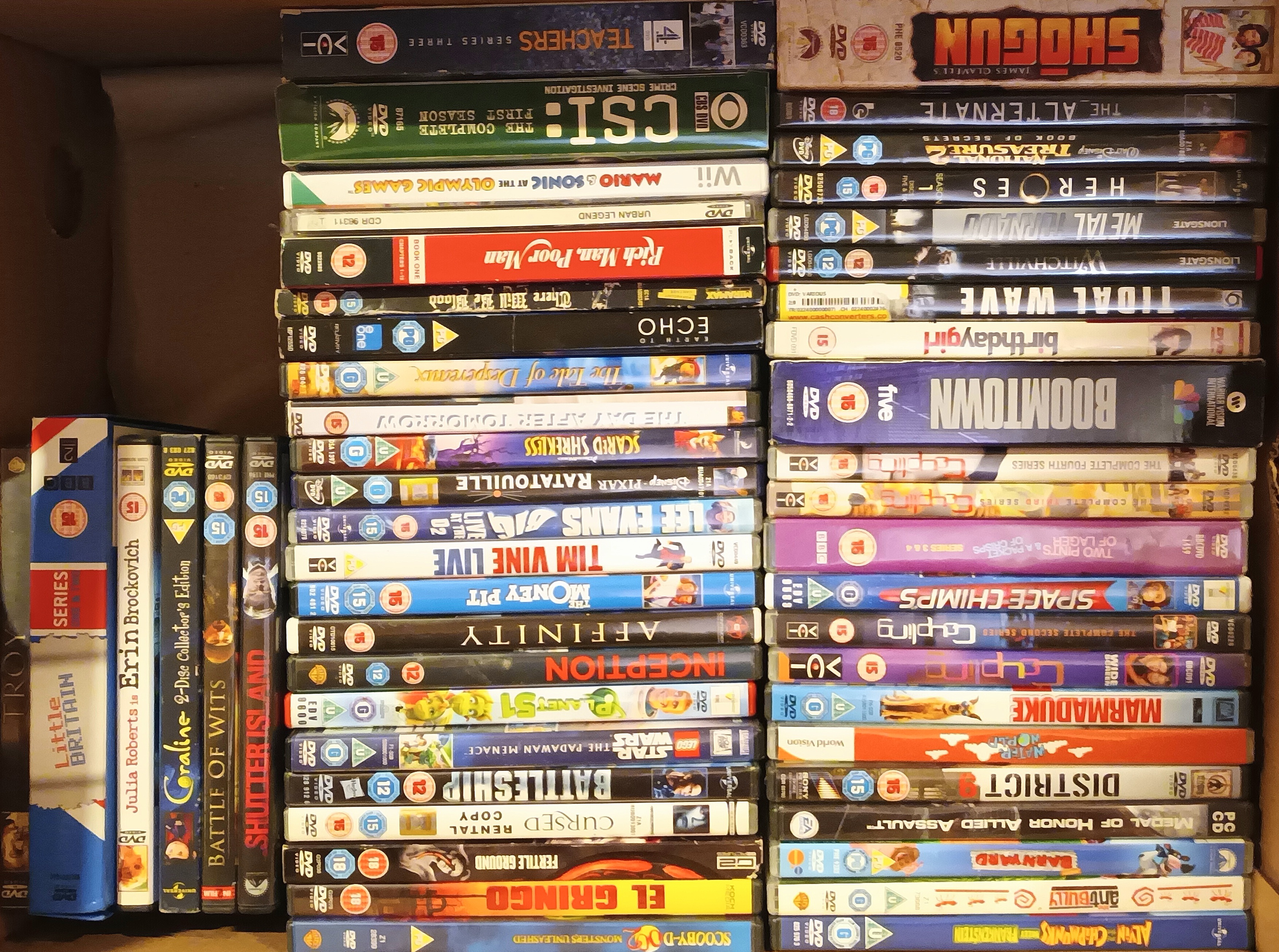 Four boxes of DVDs including films, box sets and documentaries, containing CSI, Ally McBeal, Disney,