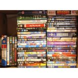 Four boxes of DVDs including films, box sets and documentaries, containing CSI, Ally McBeal, Disney,