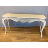 A Barker and Stonehouse Louis XV style console table, having shaped scalloped top with carved