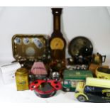 Two boxes of metalware to include candlesticks, barometer, jugs, money boxes, advertising tins and
