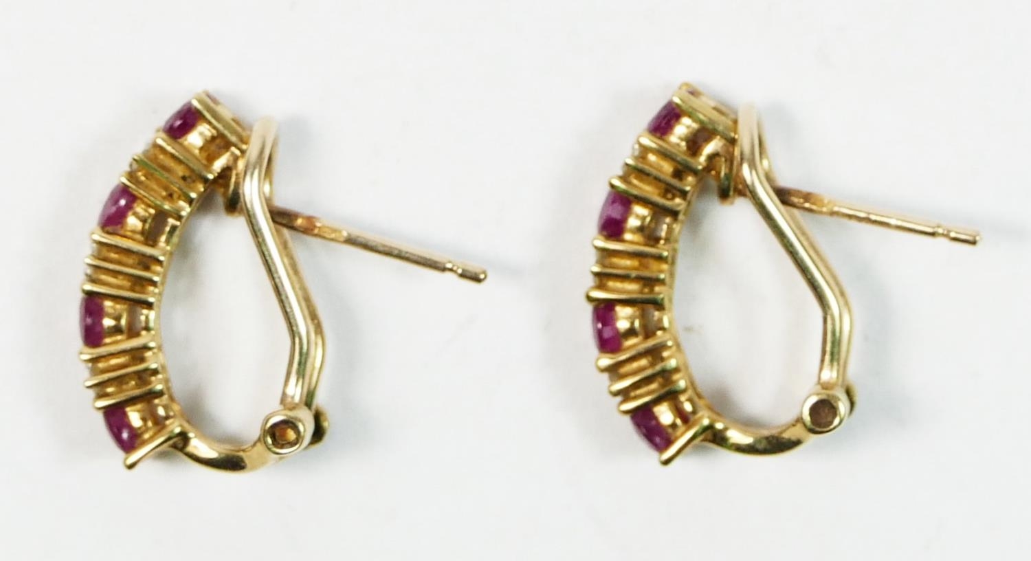 A pair of 9ct gold ruby and brilliant cut diamond ear studs, 16 x 4mm, 2.8gm - Image 2 of 2