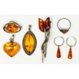 A 925 silver and amber heart pendant and five other silver and amber set jewellery