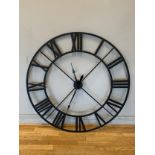 An oversized outdoor/indoor wall clock, painted metal construction, with quartz movement. 122cm