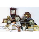 A collection of mid 20th century and later mantel clocks, lantern clocks and carriage clocks, having