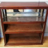 A mahogany free standing three height open bookcase. W97, D30, H102cm.