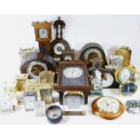 A collection of mid 20th century mantel clocks and barometers, together with traveling alarm