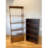 A mahogany five height freestanding shelf unit, having turned supports with drawer base, height