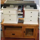 A modern Oak Furniture Land style TV cabinet, open aperture over a single drawer, next to a glazed