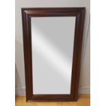 A Barker and Stonehouse wall mirror, solid mahogany frame with bevel edge glass. 120x70.