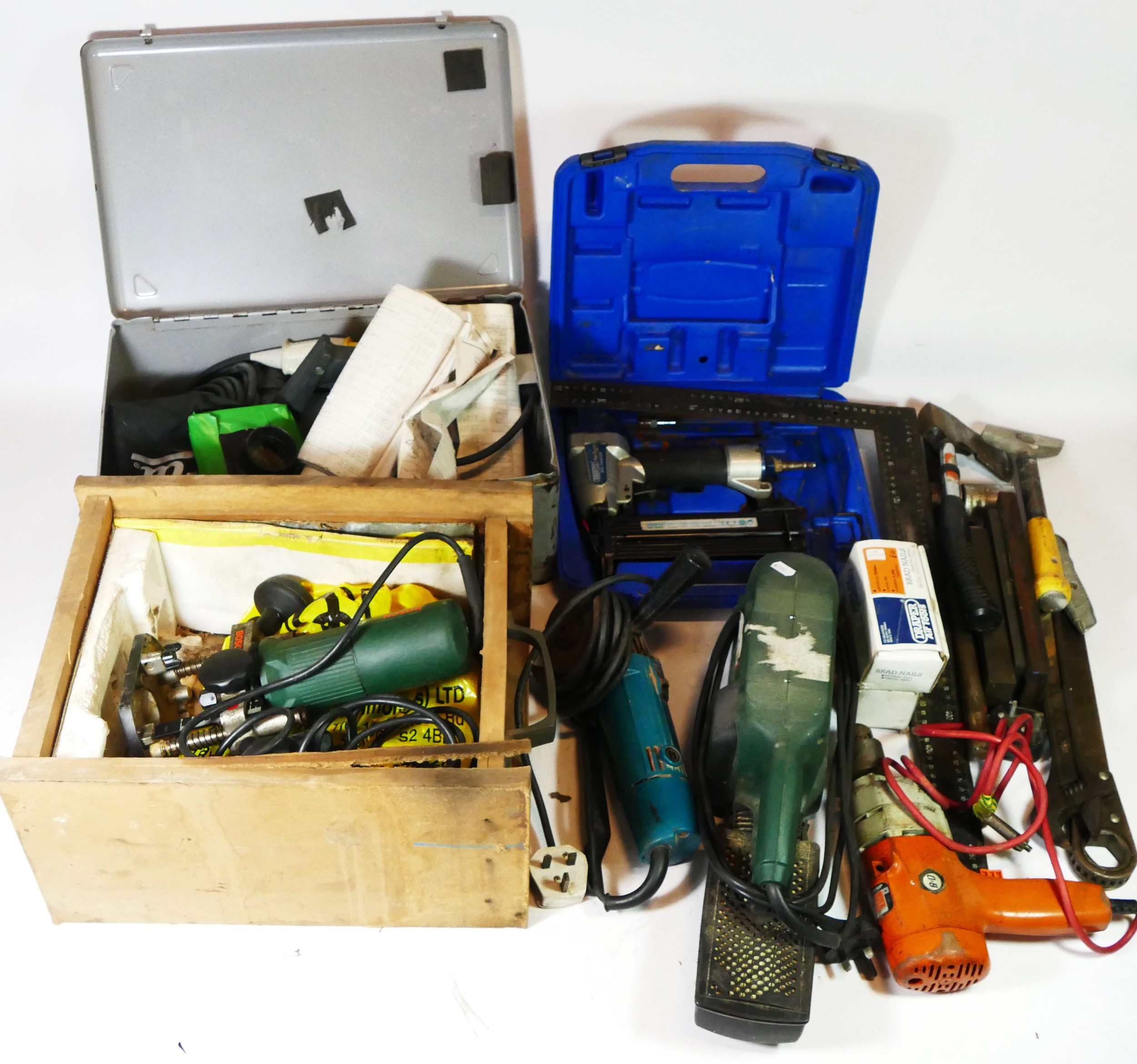 A collection of power tools and hand tools to include a Bosch sander, a grinder, a Elu planer, a