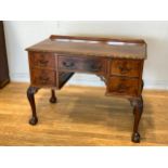 A mahogany lowboy side table, the moulded top above one central frieze drawer and two short