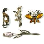 A silver and sapphire set floral brooch and three other silver brooches, 22gm