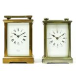 Two English carriage clocks, having enamelled dials and Roman numerals, brass cased with bevel