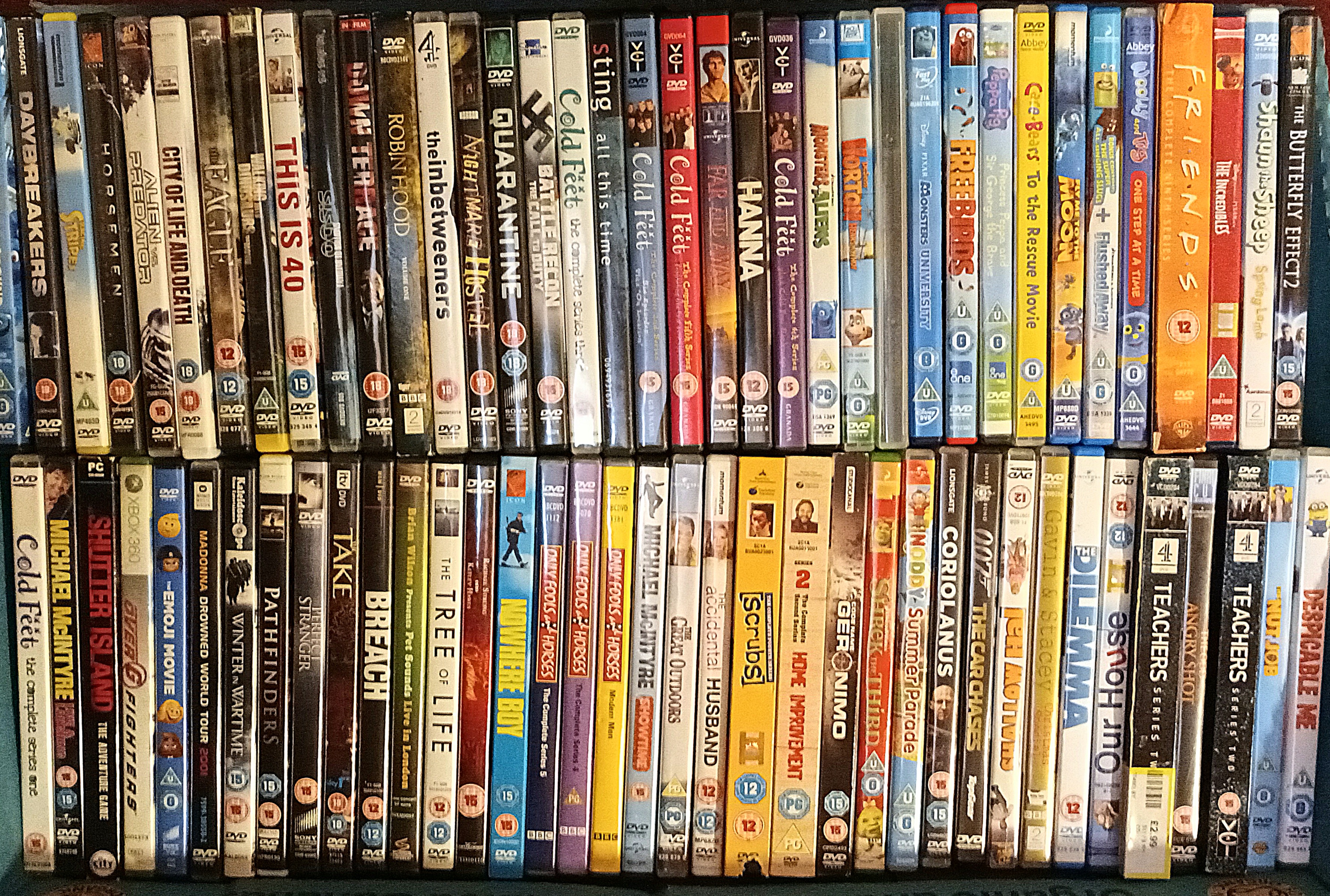 Three boxes of DVDs including films, box sets and documentaries, containing Friends, Ally McBeal,