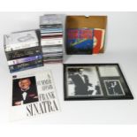 A collection of Frank Sinatra related memorabilia, to include music CD's, records, VHS tapes, a