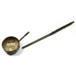 A George II silver toddy ladle, unmarked, inset with a George II silver coin, whalebone handle,