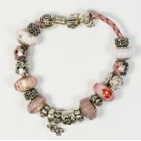 Pandora, a silver charm bracelet, 63gm, box