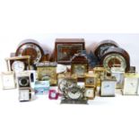 A collection of carriage clocks, mantel clocks, traveling alarm clocks, together with a quantity