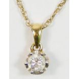 An 18K gold and brilliant cut diamond single stone pendant, approximately 0.35cts, colour estimate