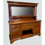 An Edwardian mahogany mirror back sideboard, shelved mirrored back, turned pilasters, above an