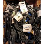 Nineteen guitar cables various lengths, by Cordial Fair Line, with other cables and light stands