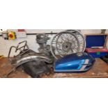 A collection of Honda 125 spares, including partial engine, tank, seat, front and rear wheels.